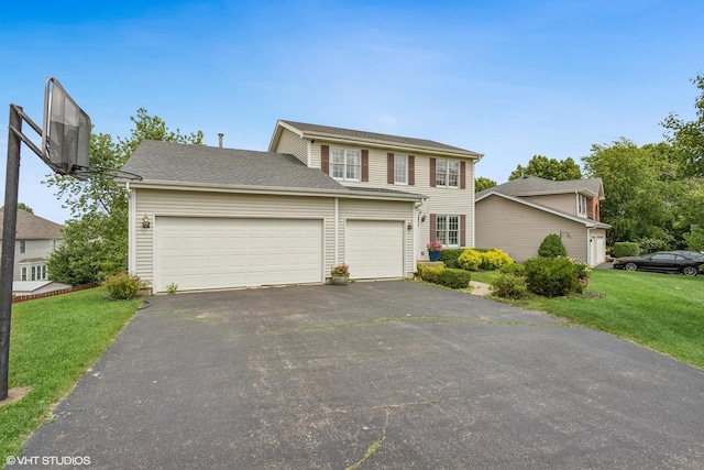 2855 Weld Rd, Elgin, IL 60124 - view of front of house with asphalt driveway, a garage, and a front yard