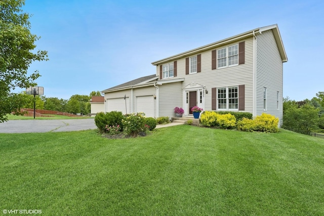 2855 Weld Rd, Elgin, IL 60124 - view of front of home with concrete driveway, an attached garage, and a front yard