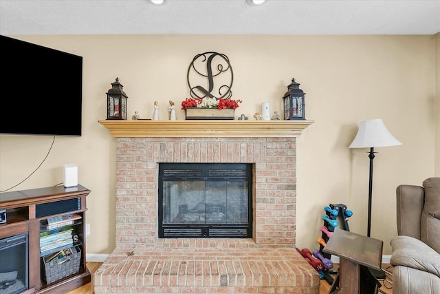 3911 Tallgrass Dr, Champaign, IL 61822 - detailed view of wood finished floors and a brick fireplace