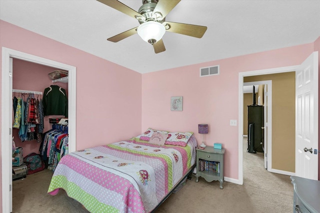 3911 Tallgrass Dr, Champaign, IL 61822 - carpeted bedroom featuring a closet, a spacious closet, and a ceiling fan