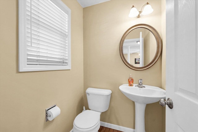 3911 Tallgrass Dr, Champaign, IL 61822 - half bathroom with toilet and baseboards