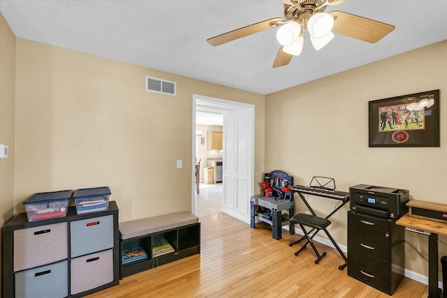 3911 Tallgrass Dr, Champaign, IL 61822 - office with light wood-style floors and ceiling fan
