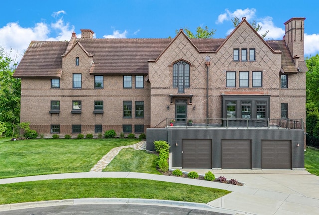 141 Loretto Ct, Wheaton, IL 60189 - view of front facade featuring a chimney, concrete driveway, an attached garage, and a front yard