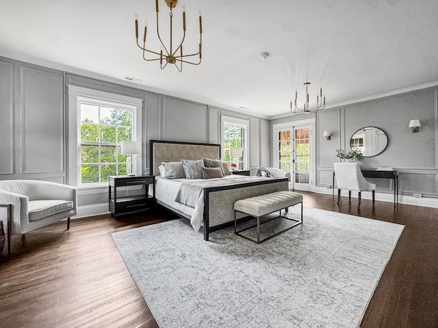 141 Loretto Ct, Wheaton, IL 60189 - bedroom featuring a decorative wall, a chandelier, multiple windows, and dark wood finished floors
