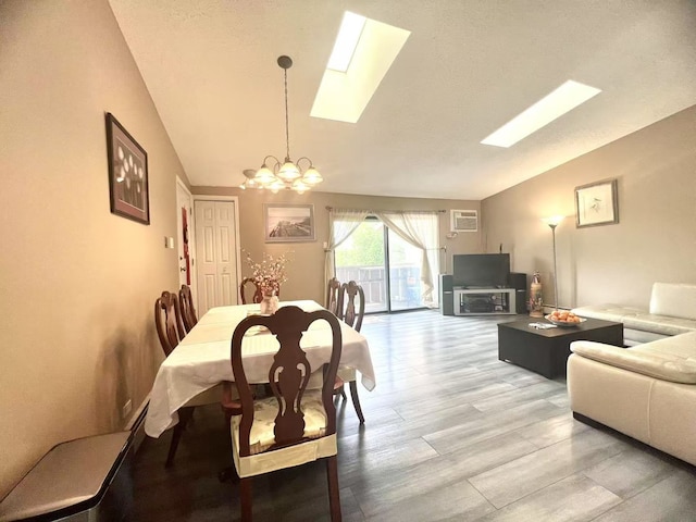 11 Echo Ct Unit 17, Vernon Hills, IL 60061 - dining room featuring vaulted ceiling, a chandelier, a skylight, and light wood-type flooring