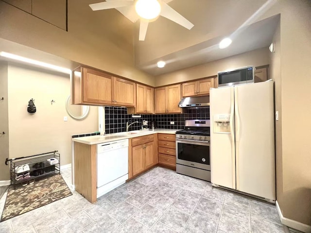 11 Echo Ct Unit 17, Vernon Hills, IL 60061 - kitchen featuring stainless steel appliances, under cabinet range hood, light countertops, tasteful backsplash, and vaulted ceiling