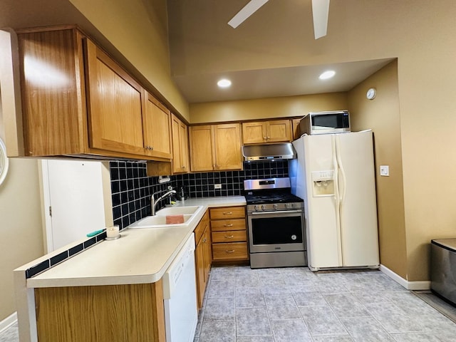 11 Echo Ct Unit 17, Vernon Hills, IL 60061 - kitchen with stainless steel appliances, under cabinet range hood, decorative backsplash, brown cabinetry, and ceiling fan