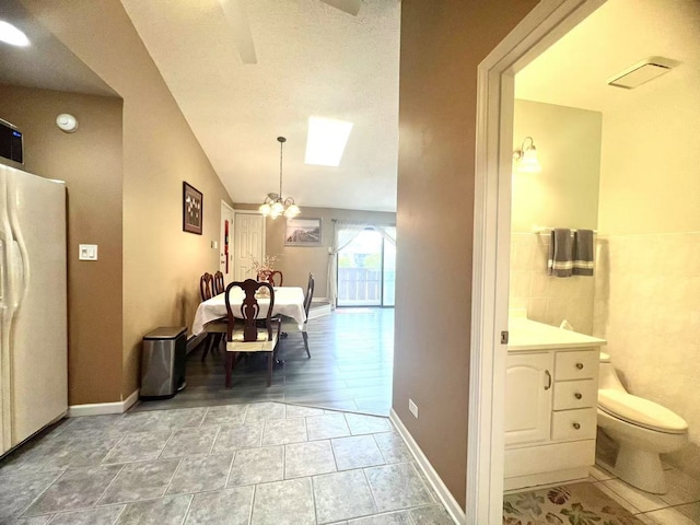 11 Echo Ct Unit 17, Vernon Hills, IL 60061 - dining space featuring a chandelier and tile walls
