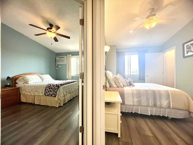 11 Echo Ct Unit 17, Vernon Hills, IL 60061 - bedroom featuring dark wood-type flooring, a textured ceiling, lofted ceiling, a ceiling fan, and a wall unit AC