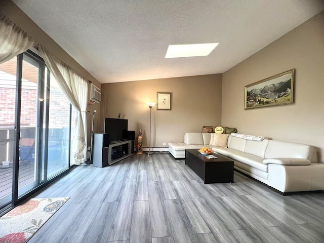 11 Echo Ct Unit 17, Vernon Hills, IL 60061 - living room with wood finished floors, a wall unit AC, a textured ceiling, a skylight, and a baseboard radiator