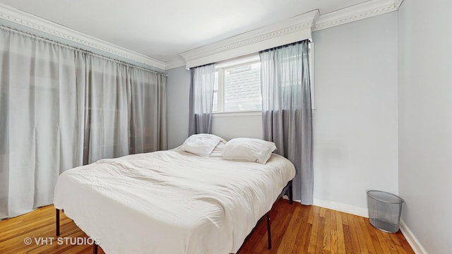 117 S Grove Ave, Oak Park, IL 60302 - bedroom featuring crown molding and wood finished floors
