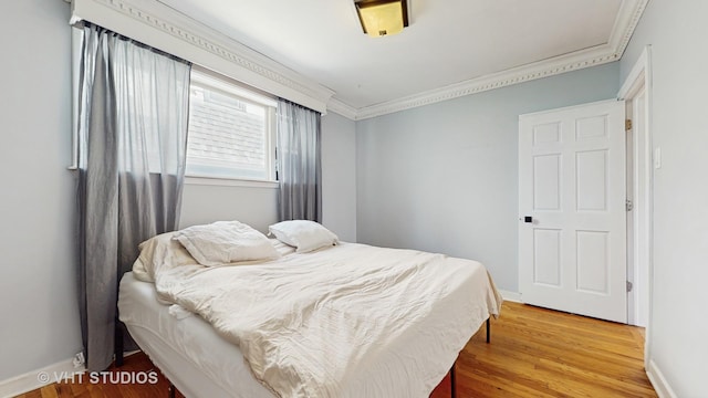 117 S Grove Ave, Oak Park, IL 60302 - bedroom featuring crown molding and wood finished floors