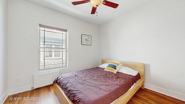 117 S Grove Ave, Oak Park, IL 60302 - bedroom featuring radiator heating unit, hardwood / wood-style floors, and ceiling fan