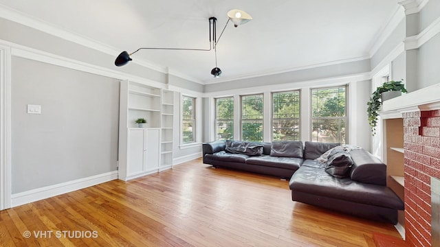 117 S Grove Ave, Oak Park, IL 60302 - living area featuring a brick fireplace, ornamental molding, wood finished floors, and built in features