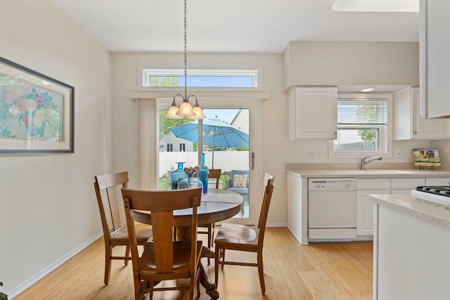 2583 Warm Springs Ln, Naperville, IL 60564 - dining area featuring light wood finished floors, a chandelier, and plenty of natural light