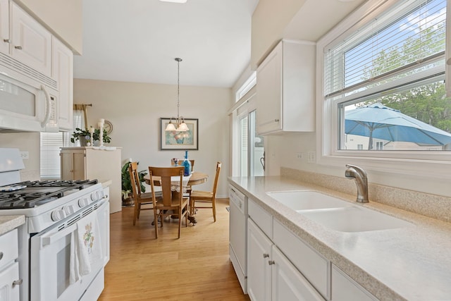 2583 Warm Springs Ln, Naperville, IL 60564 - kitchen featuring white appliances, white cabinets, light wood finished floors, and light countertops