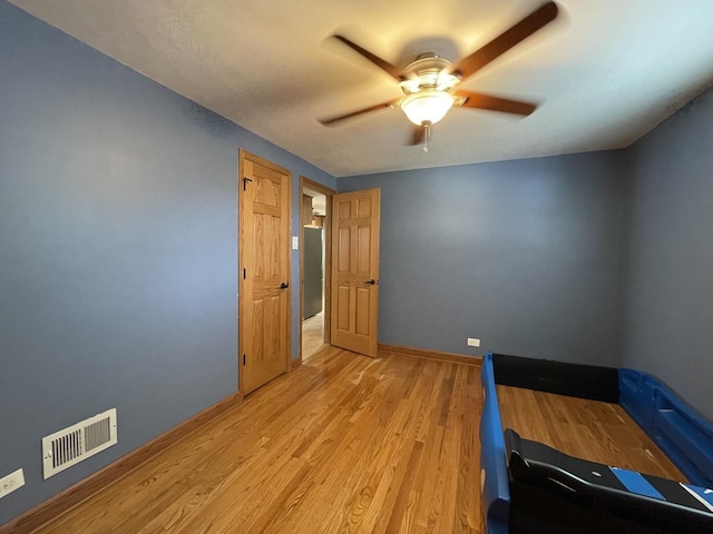 10505 S Central Park Ave, Chicago, IL 60655 - unfurnished bedroom featuring light wood-style flooring and ceiling fan