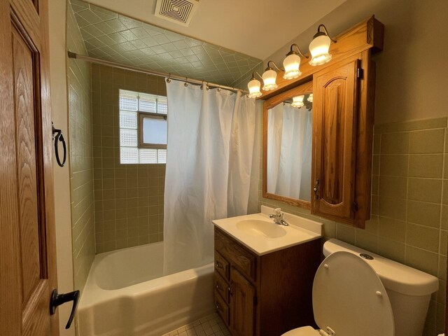 10505 S Central Park Ave, Chicago, IL 60655 - full bathroom featuring vanity, shower / bath combination with curtain, and tile walls