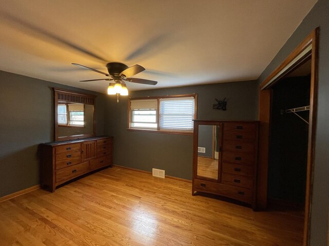 10505 S Central Park Ave, Chicago, IL 60655 - unfurnished bedroom with light wood finished floors, a closet, and ceiling fan