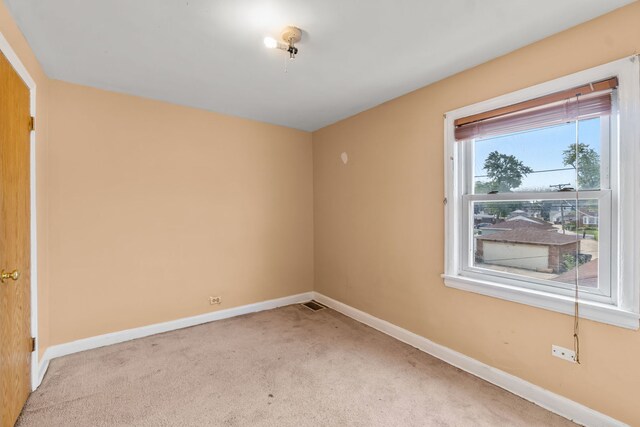 3914 Madison St, Bellwood, IL 60104 - carpeted empty room with baseboards