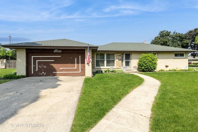 1550 Marshall Dr, Des Plaines, IL 60018 - view of front of home with brick siding, concrete driveway, an attached garage, and a front lawn