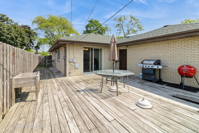 1550 Marshall Dr, Des Plaines, IL 60018 - wooden terrace featuring area for grilling, a fenced backyard, and outdoor dining area