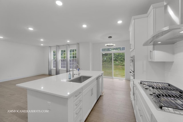 269 S Pointe Ave, South Elgin, IL 60177 - kitchen with wall chimney range hood, stainless steel appliances, recessed lighting, plenty of natural light, and light countertops