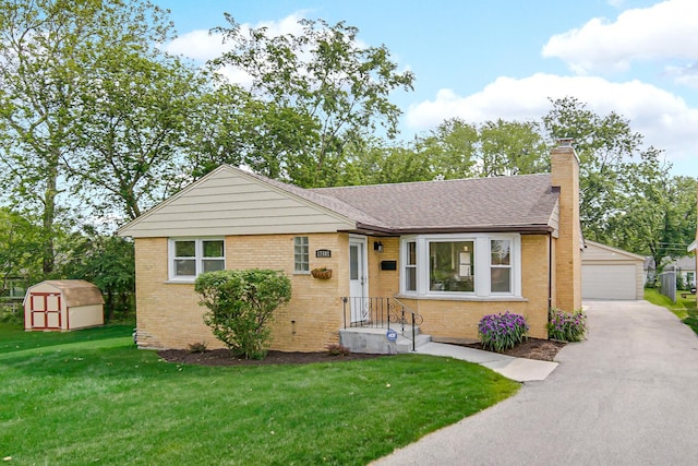 17401 Emerson Ave, Hazel Crest, IL 60429 - view of front of house featuring a chimney, a garage, brick siding, and a front yard