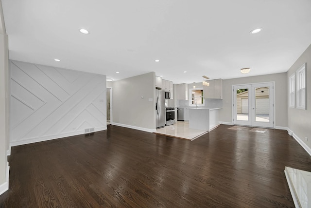 17401 Emerson Ave, Hazel Crest, IL 60429 - unfurnished living room with wood finished floors, recessed lighting, and french doors