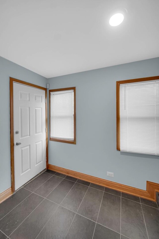 1515 E 85th St, Chicago, IL 60619 - foyer featuring baseboards and dark tile patterned flooring