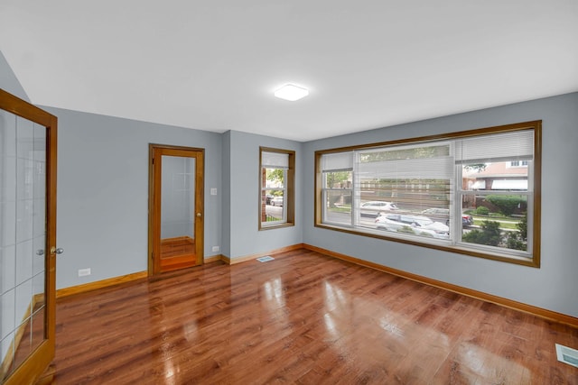 1515 E 85th St, Chicago, IL 60619 - empty room featuring baseboards and wood finished floors