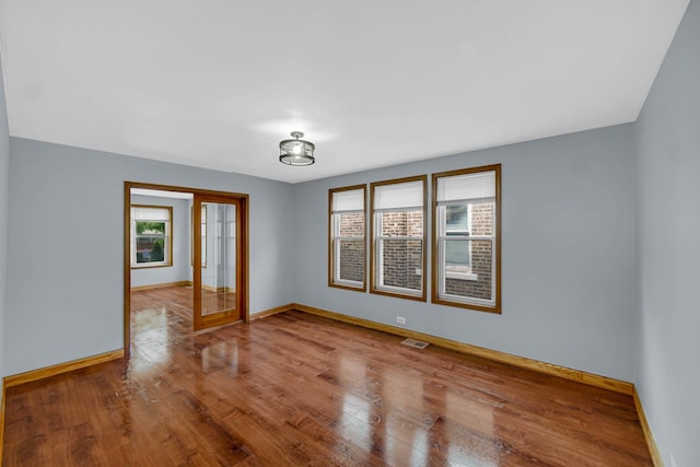 1515 E 85th St, Chicago, IL 60619 - spare room with wood finished floors and baseboards
