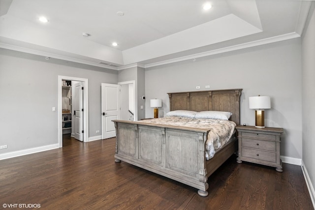 1780 Prairie Ave, Northbrook, IL 60062 - bedroom featuring a tray ceiling, dark wood finished floors, recessed lighting, a spacious closet, and ornamental molding