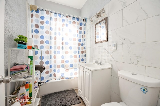 7514 S Dante Ave, Chicago, IL 60619 - bathroom featuring vanity, shower / tub combo, and tile walls