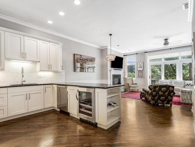 2052 W Chicago Ave Unit 2, Chicago, IL 60622 - kitchen featuring wine cooler, open floor plan, stainless steel dishwasher, open shelves, and a glass covered fireplace