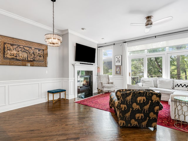 2052 W Chicago Ave Unit 2, Chicago, IL 60622 - living area with crown molding, wood finished floors, a fireplace, wainscoting, and a ceiling fan