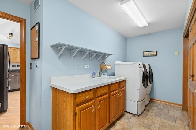 401 Woodside Dr, Wood Dale, IL 60191 - laundry area with washer and dryer, cabinet space, and stone finish flooring