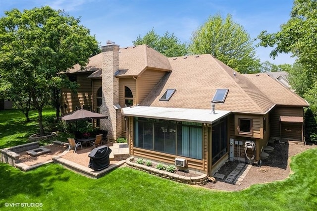401 Woodside Dr, Wood Dale, IL 60191 - back of property with a chimney, a sunroom, a patio, a lawn, and a shingled roof