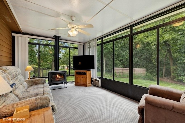 401 Woodside Dr, Wood Dale, IL 60191 - sunroom / solarium with a wood stove, carpet floors, ceiling fan, an AC wall unit, and a wall of windows