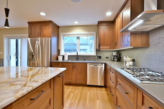 717 S Washington St, Elmhurst, IL 60126 - kitchen with stainless steel appliances, wall chimney range hood, light wood finished floors, brown cabinetry, and recessed lighting