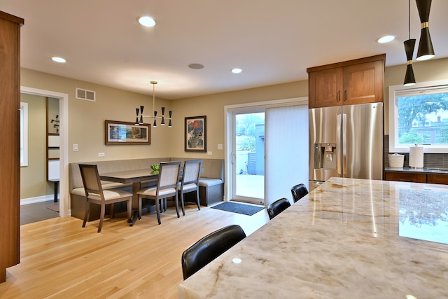 717 S Washington St, Elmhurst, IL 60126 - dining space with plenty of natural light, light wood-style floors, recessed lighting, and a chandelier
