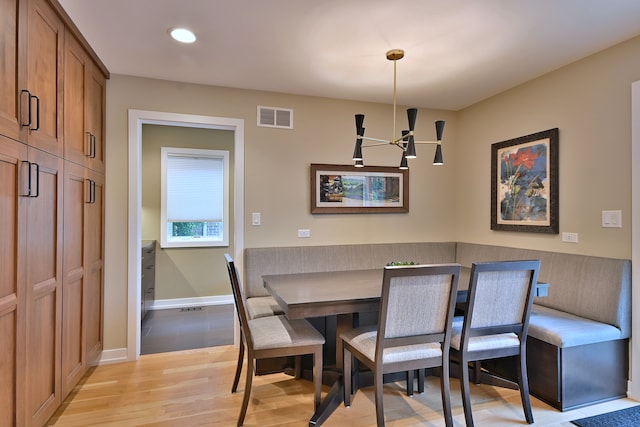 717 S Washington St, Elmhurst, IL 60126 - dining room with light wood-type flooring, a chandelier, and recessed lighting