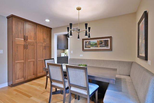 717 S Washington St, Elmhurst, IL 60126 - dining room featuring light wood-style floors, recessed lighting, and a chandelier