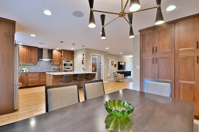 717 S Washington St, Elmhurst, IL 60126 - dining space featuring light wood-style floors and recessed lighting