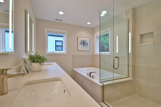 717 S Washington St, Elmhurst, IL 60126 - full bathroom with a bath, a shower stall, double vanity, and recessed lighting
