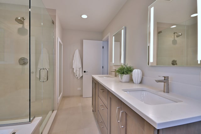 717 S Washington St, Elmhurst, IL 60126 - bathroom featuring a shower stall, double vanity, tile patterned floors, and recessed lighting