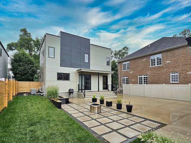 717 S Washington St, Elmhurst, IL 60126 - rear view of house with a patio, a fenced backyard, and entry steps