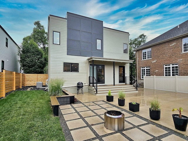 717 S Washington St, Elmhurst, IL 60126 - back of house with an outdoor fire pit, a patio area, and a fenced backyard