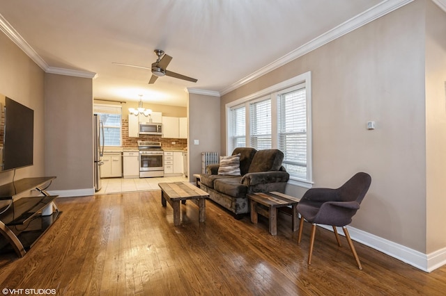 6970 N Wolcott Ave Unit 1, Chicago, IL 60626 - living area featuring light wood-style flooring, a chandelier, ceiling fan, and crown molding