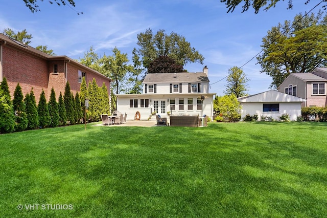 4335 Lee St, Skokie, IL 60076 - rear view of property with french doors, a chimney, a patio, and a lawn